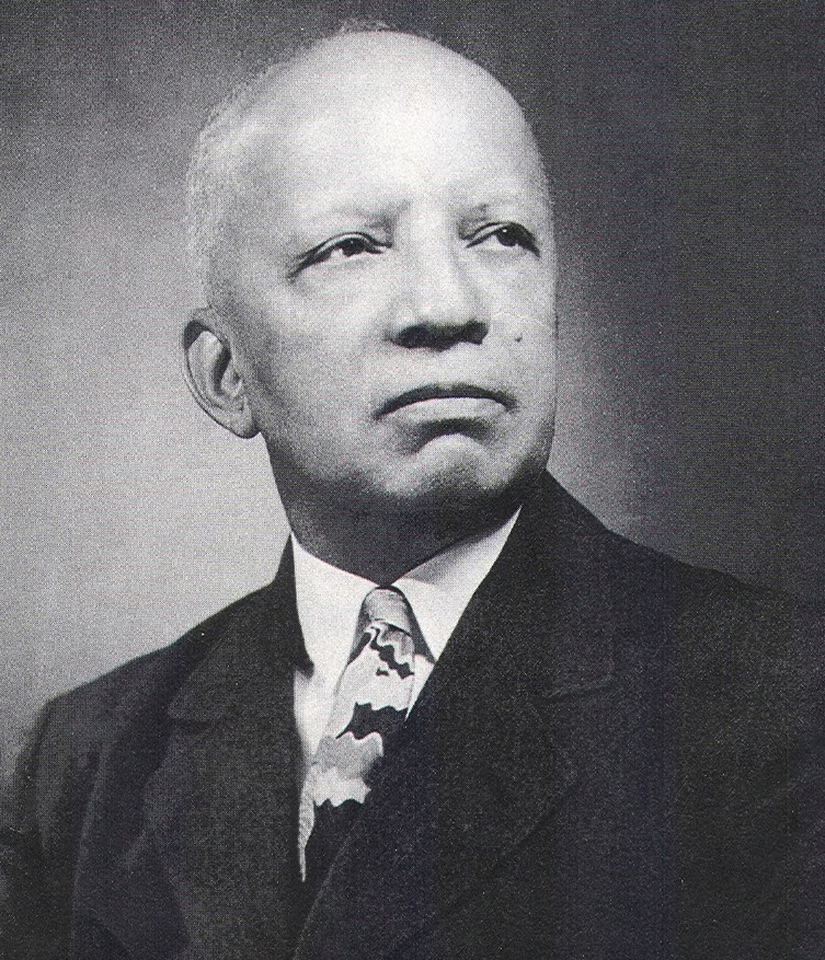 Carter G Woodson in a suit and tie