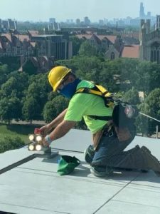 Taylor Electric Company Employee Installing Lights on High Rise Building 2022 (Photo Courtesy of the Taylor Electric Company and the Taylor Family)