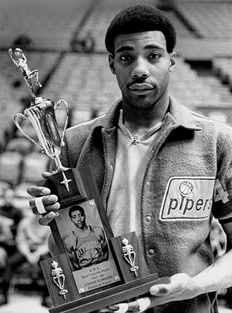 Professional basketball player Connie Hawkins with the American Basketball Association Most Valuble Player Award for the 1967–68 season.