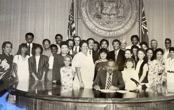 Gov. John Waihee Signing the Bill Making the MLK Birthday a Holiday in Hawaii, April 29, 1988 (Courtesy of Daphne Barbee Wooten)